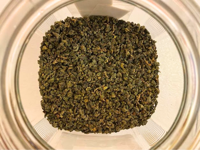 Tung Ting Oolong Tea leaves in a jar