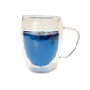 Clear mug of butterfly pea flower tea