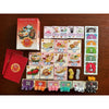 Makan Mania - cards, dice, and rulebooks outside of the box.