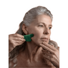 Woman using The Jade Gua Sha Facial Lifting Tool