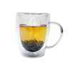 Clear mug with brewed yin hao jasmine tea