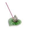Laughing Buddha on leaf incense holder with incense