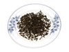 Loose Yunnan Pu-Erh Black Tea on plate.